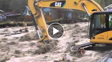 Excavators in flooding river - RECUT