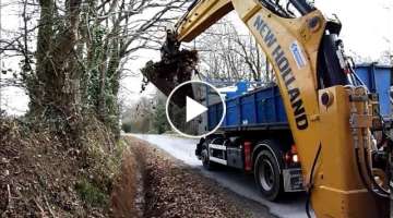 New holland b 110 ditch cleaning with adjustable bucket.