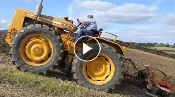 My 63 year old mum on her tractor plowing VERY steep hills