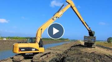 Long Reach Excavator Digging Widening River Canal CAT 320D L Komatsu PC200