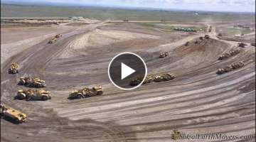 Digging new landfill cell with fleet of Caterpillar scrapers (Part 2)